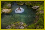 A wedding dress turns into a water lily at a trash the dress session